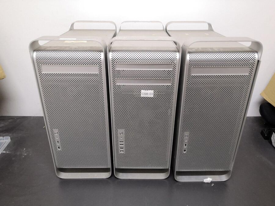Three Apple Mac Pro workstation towers