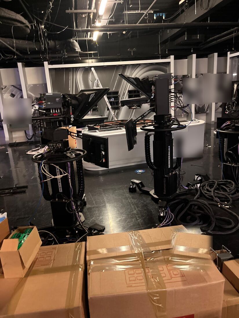 Television studio floor with pedestal cameras and teleprompters before clearance