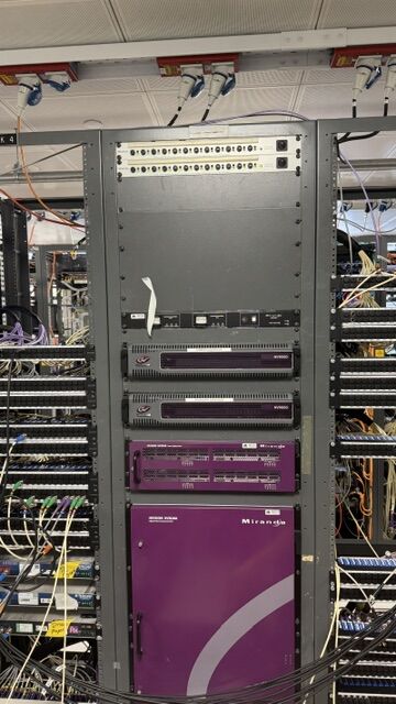 Purple Miranda broadcast routing frame in an equipment rack